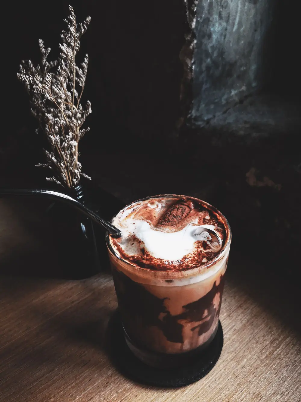 Chocolate milkshake in a glass with whipped cream